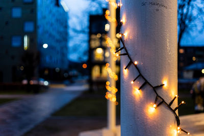 Close-up of illuminated lights at night