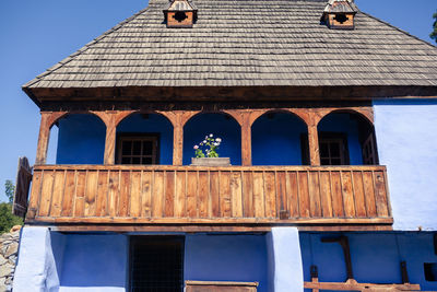 Low angle view of old building against blue sky