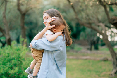 Mother and daughter in garden