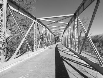 Bridge over road against sky