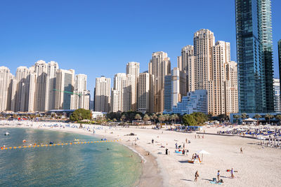 Beautiful modern residential buildings with beach in foreground