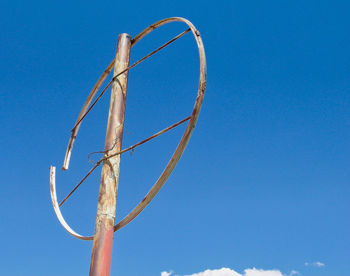 Low angle view of basketball hoop against blue sky