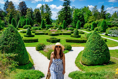 Portrait of woman standing in park