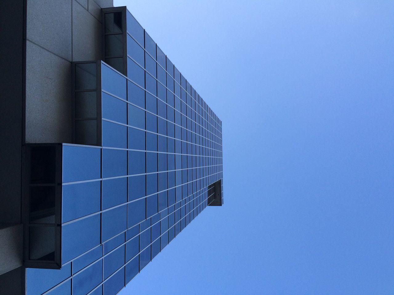 architecture, building exterior, clear sky, built structure, blue, low angle view, reflection, no people, modern, skyscraper, day, outdoors, sky, city, office building exterior, office block