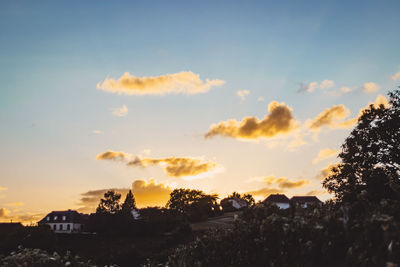 Panoramic view of cityscape against sky during sunset