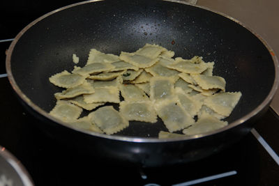 High angle view of meat in cooking pan