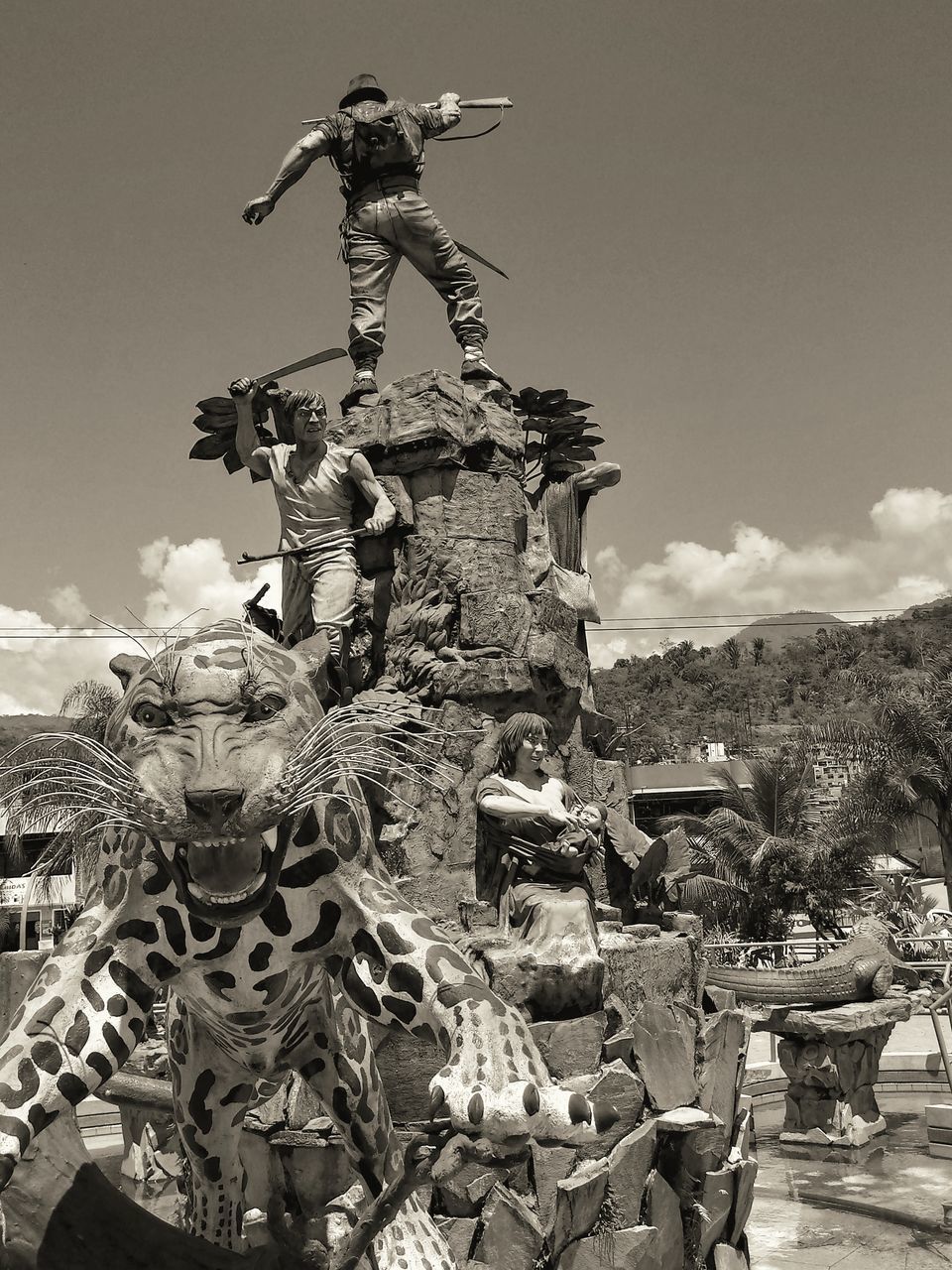 LOW ANGLE VIEW OF STATUE AGAINST TREES