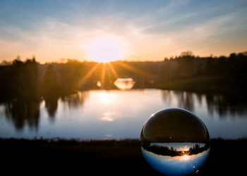 Scenic view of lake against sky during sunset