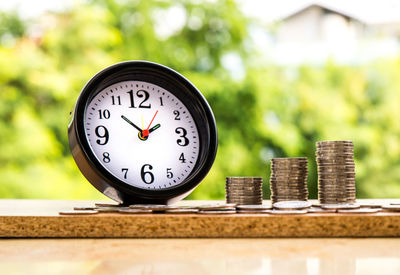 Close-up of clock on table