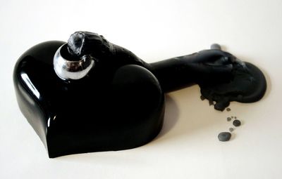 Close-up of spoon over white background