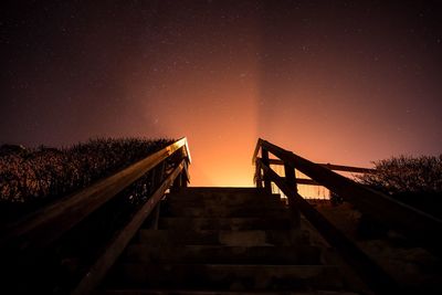 Low angle view of bridge against sky at night