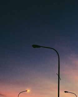 Low angle view of street light against sky