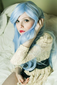 Portrait of confident woman with dyed hair at home