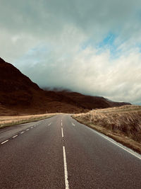 Empty road against sky