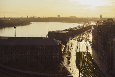 High angle view of bridge over river by buildings in city