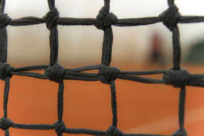 Close-up of rope tied fence