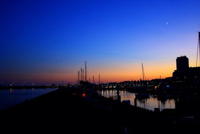 View of illuminated harbor at night