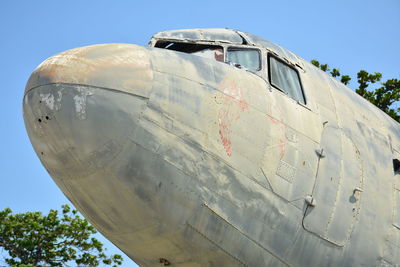 Low angle view of airplane against clear sky