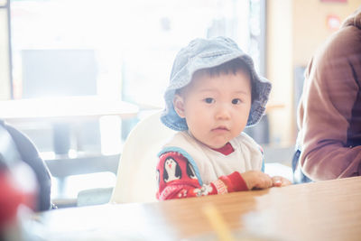 Portrait of cute boy at table