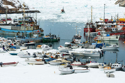 Boats moored at harbor