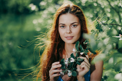 Portrait of young woman looking away