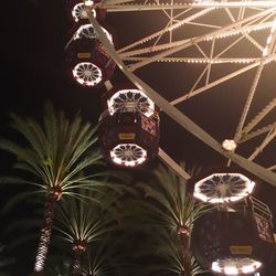 Low angle view of illuminated lights at night