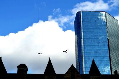 Low angle view of buildings against blue sky