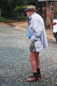 Low section of man walking on street