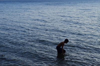 Man swimming in sea