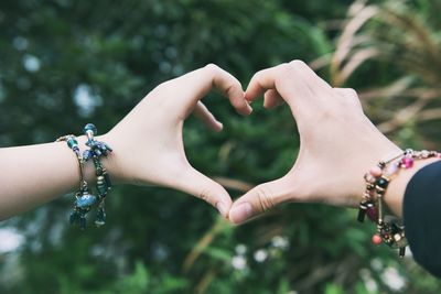 Cropped image of woman holding hands