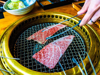 Cropped hand of person preparing food