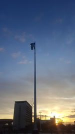 Low angle view of buildings against sky during sunset