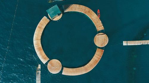 Aerial view of circular pier over sea