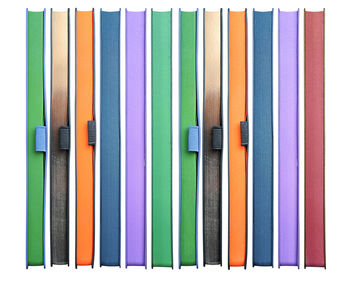 High angle view of multi colored pencils on white background