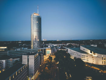 Famous tower and aalto theater in essen at dusk