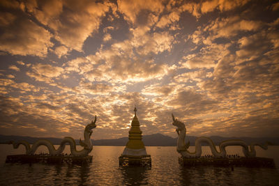 Pagoda at phayao lake during sunset