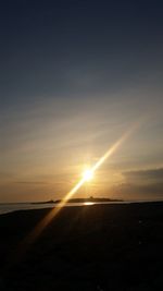 Scenic view of beach against sky during sunset
