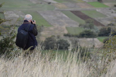 Rear view of man on field