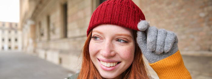 Portrait of young woman wearing hat