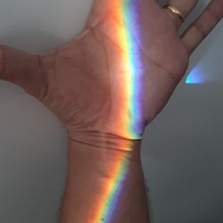 Close-up of rainbow over blurred background