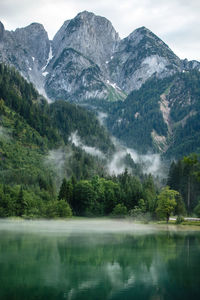 Scenic view of lake and mountains against sky