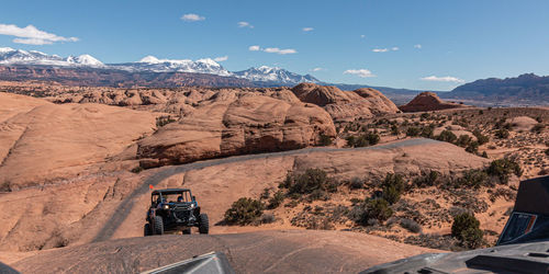 Panoramic view of a 4x4 tour in rugged sandstone terrain on a trail called hell's revenge