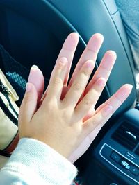 Close-up of hand holding car