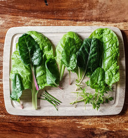 High angle view of vegetables on cutting board