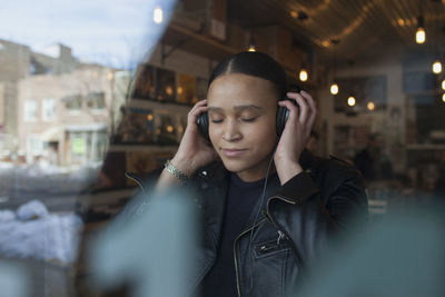 Young woman wearing headphones.