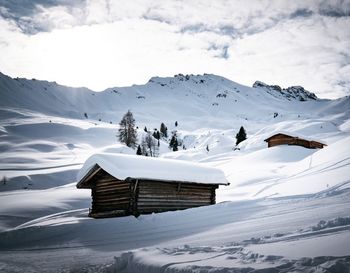 Scenic view of snow covered mountains against sky