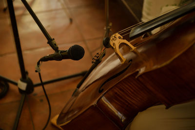 High angle view of violin by microphone