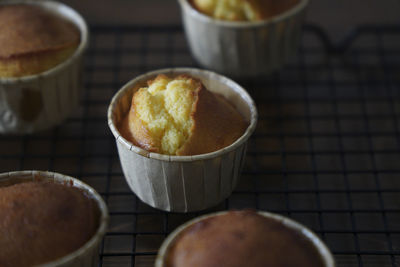 There are several delicious lemon honey cupcakes just made on the table