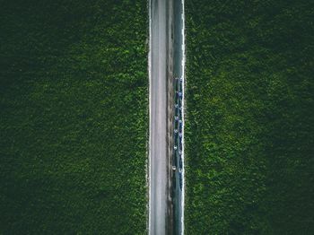 Aerial view of road amidst field