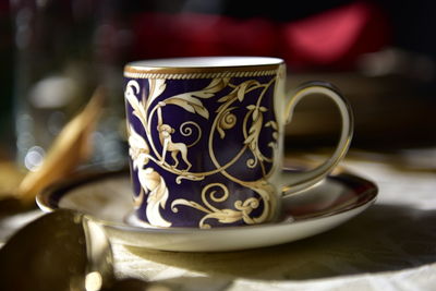 Close-up of coffee cup on table